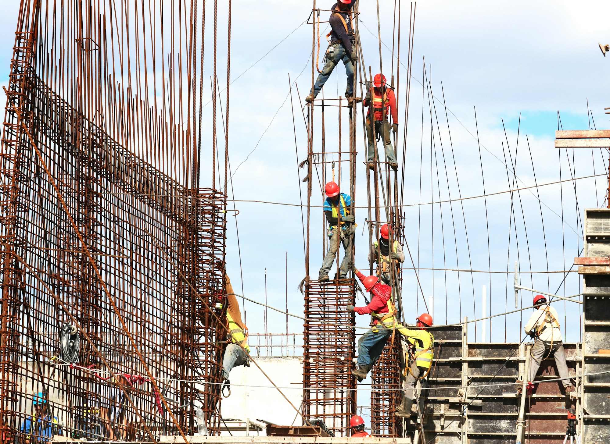 Construction workers on a building site — addressing structural repairs and maintenance common in strata schemes